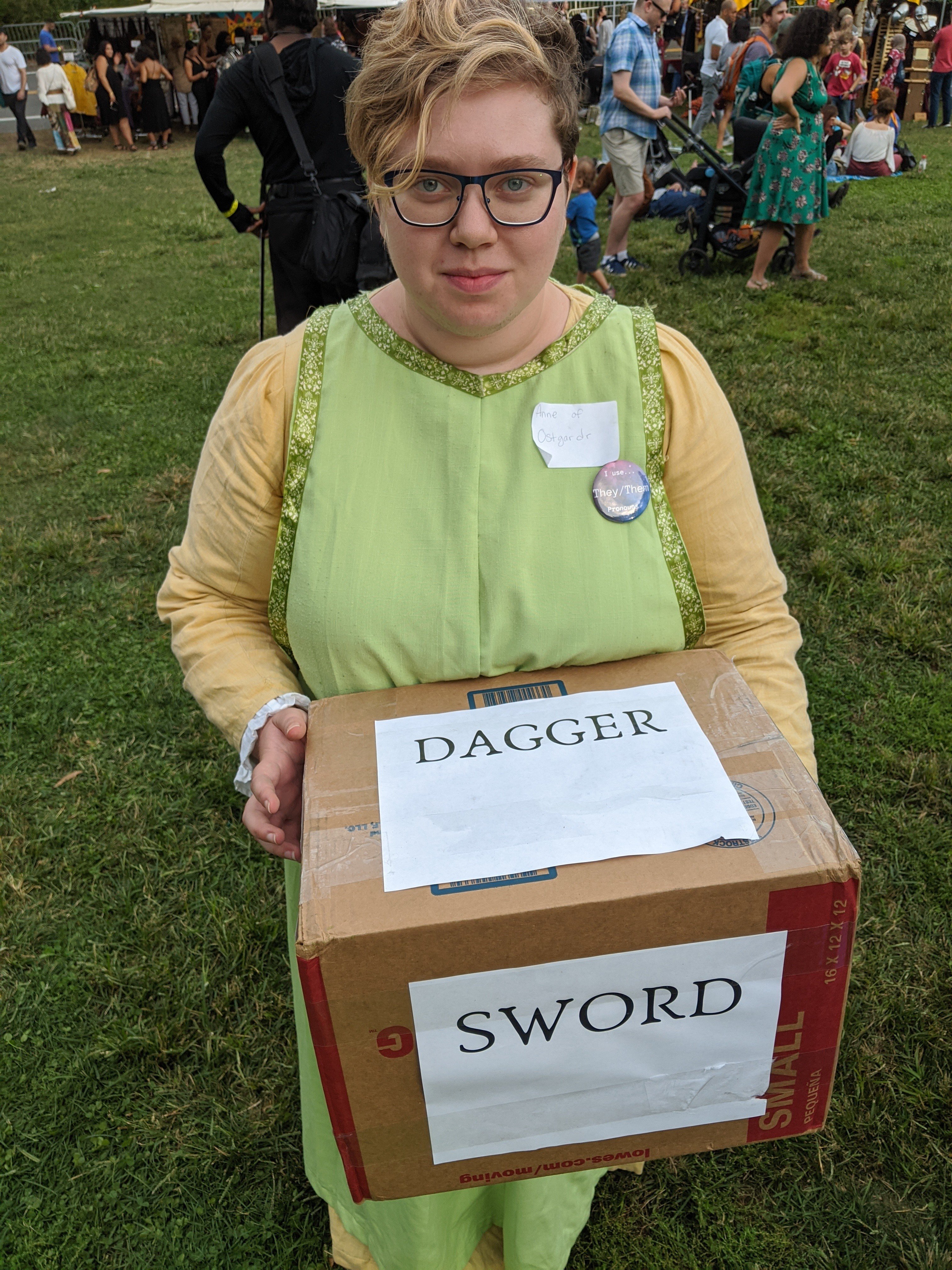 Me holding the 'loaded die', with sides "DAGGER" and "SWORD" visible.